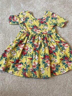 Ruffle Butts Yellow Floral Twirl Dress with Red & Green Accents